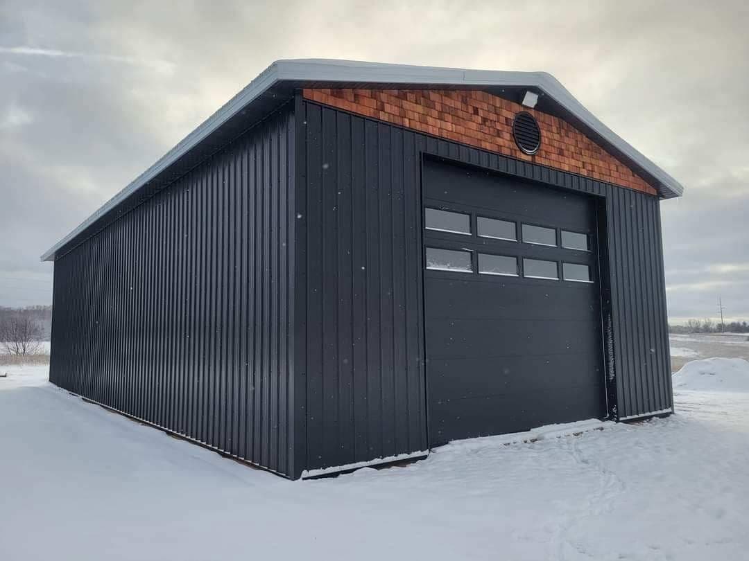 Tall steel shop door in a Northern Michigan winter