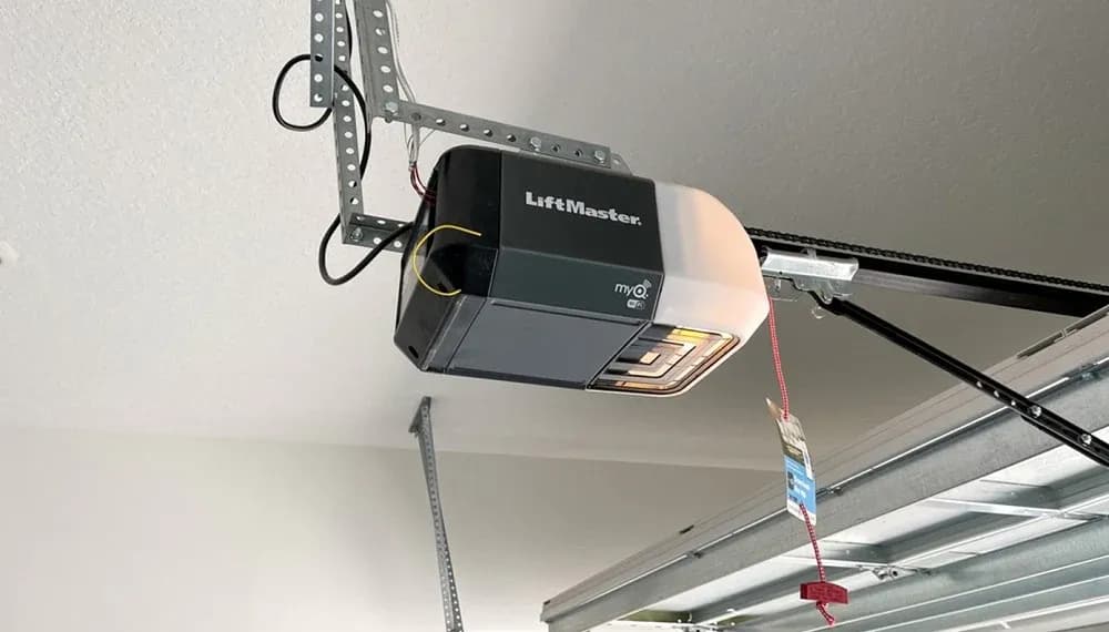 Garage door opener mounted on the ceiling of a Northern Michigan garage